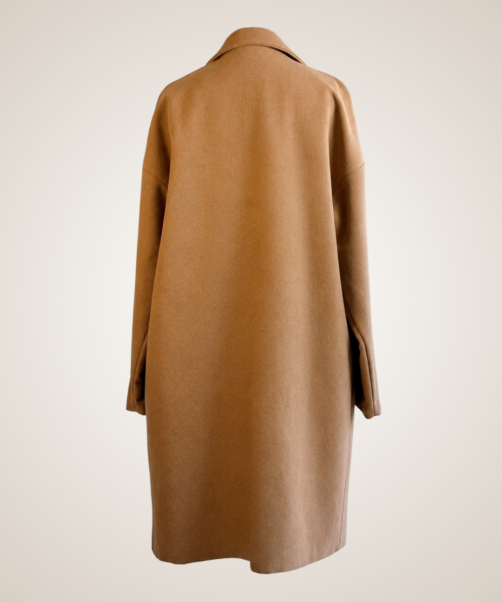 A camel brown wool coat shown from the back, displayed on a neutral cream-colored mannequin against a light beige background.