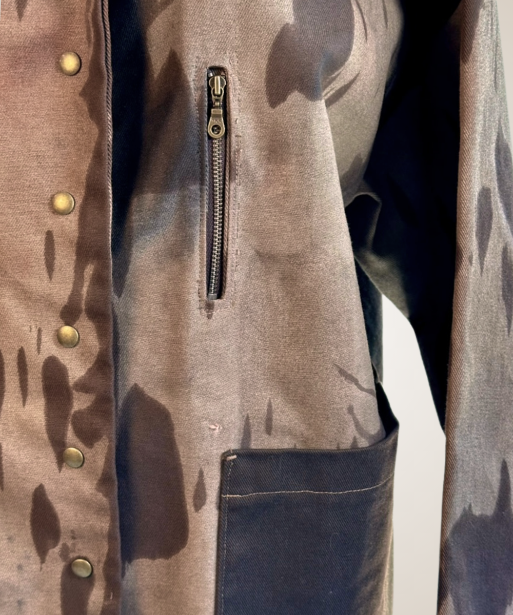 A close-up of a pair of a jacket displayed on a mannequin torso.